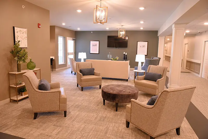 large common area with seating, artwork and tv