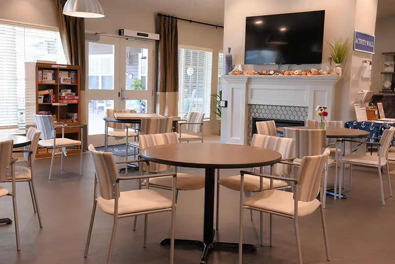 community room with tables and games