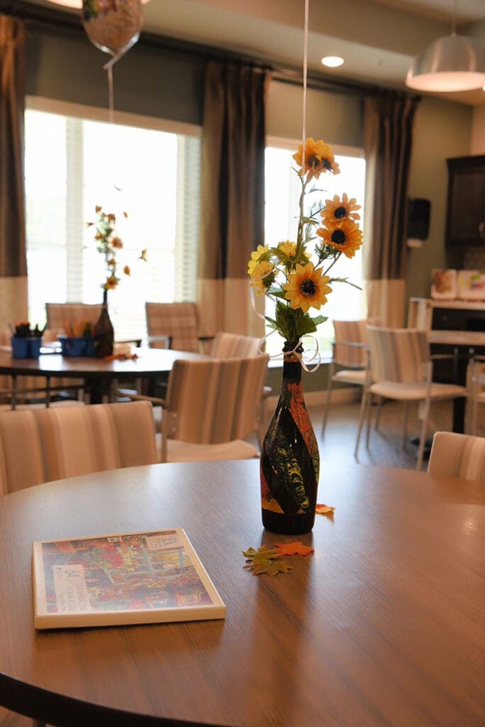 dining table with flowers and balloon centerpiece